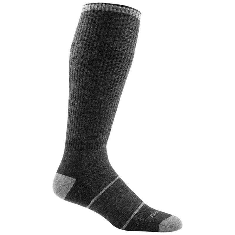 A single dark gray knee-high men's sock with lighter gray accents on the toe, heel, and top band. The DARN TOUGH PAUL BUNYAN GRAVEL - MENS from Darn Tough has a ribbed texture and offers a lifetime guarantee for durability.