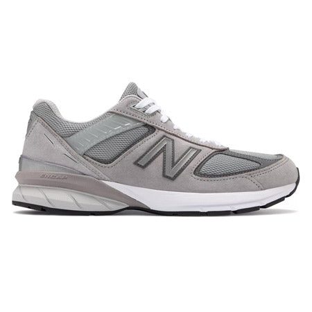 A side view of a grey New Balance NEW BALANCE 990V5 GREY - MENS running shoe with white laces and a white sole, featuring a large "N" logo on the side and ENCAP midsole technology.