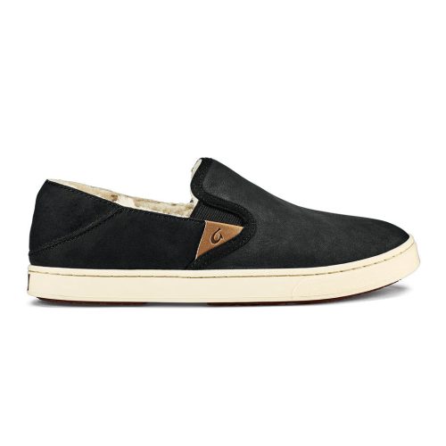 A black slip-on shoe with a white sole, a small brown accent patch on the side, and a durable sneaker outsole. The interior features a light-colored fuzzy shearling lining for added comfort. This is the OLUKAI PEHUEA HEU LAVA ROCK/LAVA ROCK - WOMENS by Olukai.