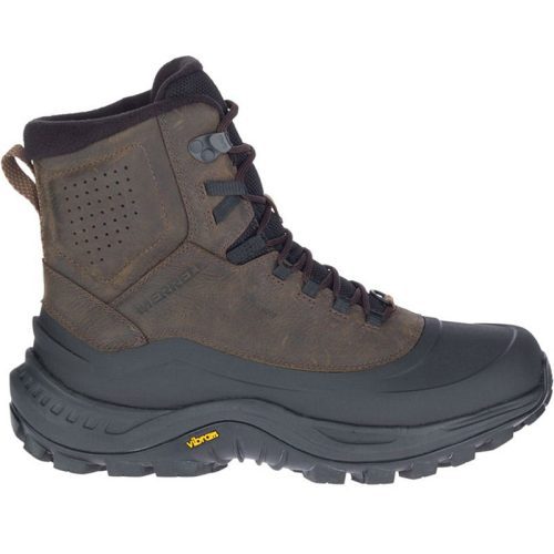 Side view of a brown and black MERRELL THERMO OVERLOOK 2 MID WP BROWN - MENS winter boot with a rugged sole featuring Vibram Arctic grip, black laces, and a perforated ankle section. The boot has "Merrell" embossed on the side and a yellow "Vibram" logo on the sole. It also boasts waterproof insulation for added protection against the elements.