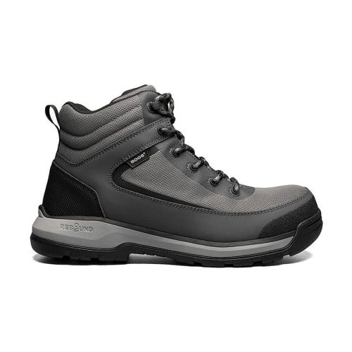 A grey and black hiking boot with a thick sole, ankle support, and a lace-up design, the Bogs BOGS SHALE MID COMPOSITE TOE BOOT GREY - MENS features a slip-resistant design, displayed against a white background.