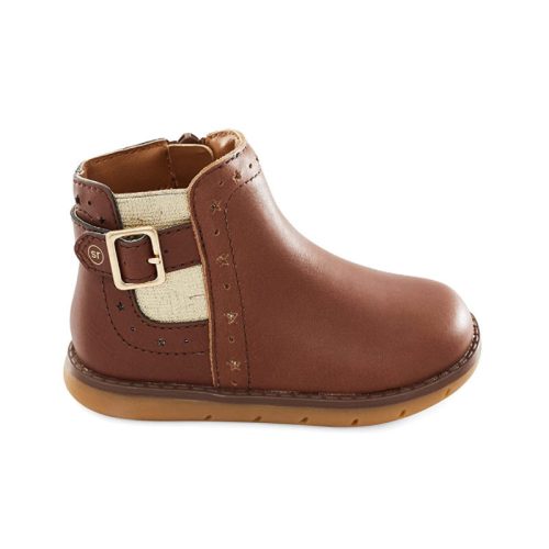 The Stride Rite STRIDE RITE SRT AGNES BROWN - KIDS boot for children features a brown ankle design with a beige side panel, adorned with a buckle and stitched accents. With its rounded toe, flat tan rubber sole, and contoured insole for added comfort, it's perfect for little feet.