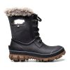 A black winter boot with fur trim and a slip-resistant outsole, like the BOGS ARCATA TONAL CAMO BLACK - WOMENS by Bogs.