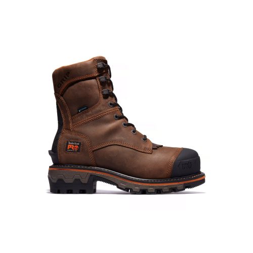 A Timberland TIMBERLAND PRO BOONDOCK HD COMP TOE LOGGER BROWN - MENS, a brown, high-top, lace-up work boot with black rubber reinforcements and rugged tread, offering electrical hazard protection.