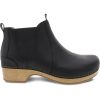 The Dansko DANSKO BECKA BLACK - WOMEN are black leather ankle booties with a low wooden heel and black elastic side panels, perfect for any chic ensemble.