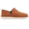 A brown slip-on suede shoe with white sole and elastic side panels, featuring Treadlite by UGG technology, is shown in a side profile view. This is the Ugg UGG ROMEO SLIPPER TAN - MENS.