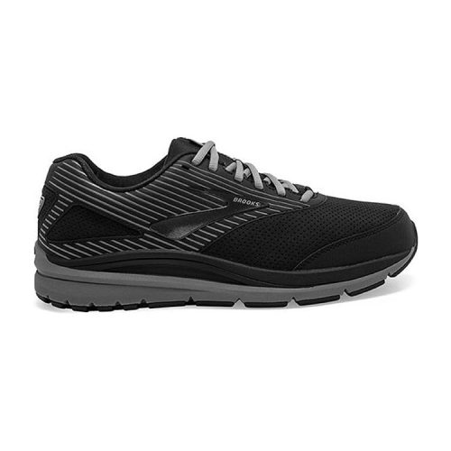 A Brooks BROOKS ADDICTION WALKER SUEDE BLACK/PRIMER - MENS athletic shoe with grey accents, featuring a lace-up design, runner-tech cushioning, and a textured rubber sole.