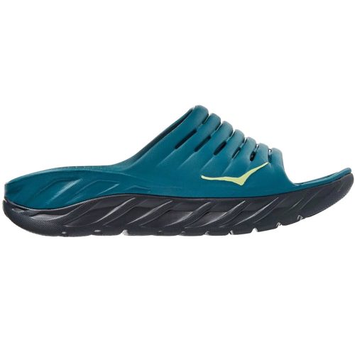 A Hoka HOKA ORA RECOVERY SLIDE BLUE CORAL/BUTTERFLY - MENS with a black thick sole, featuring Meta-Rocker technology, grooves, and perforations for breathability.