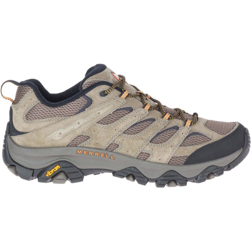 A side view of a beige and black **Merrell** **MERRELL MOAB 3 WALNUT - MENS** hiking shoe with a rugged Vibram® outsole and yellow logo on the heel.