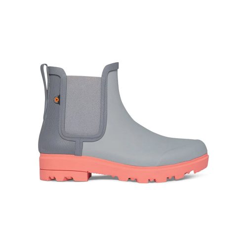 A side view of a Bogs BOGS HOLLY CHELSEA GREY - WOMENS with a coral-colored sole, featuring elastic panels and a pull tab at the back, enhanced with eco-friendly EVA footbed and DuraFresh bio-technology.