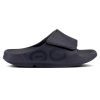 A single black orthopedic sandal featuring an adjustable upper strap with a hook-and-loop fastener and OOfoam technology for superior comfort, the OOFOS SPORT FLEX MATTE BLACK - MENS by Oofos.