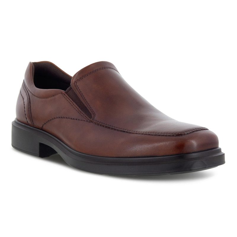 A brown leather slip-on men's casual shoe with black soles, featuring premium leather and visible stitching details, the **ECCO HELSINKI 2.0 APRON SLIP ON COGNAC - MENS** by **Ecco** offers both style and comfort.