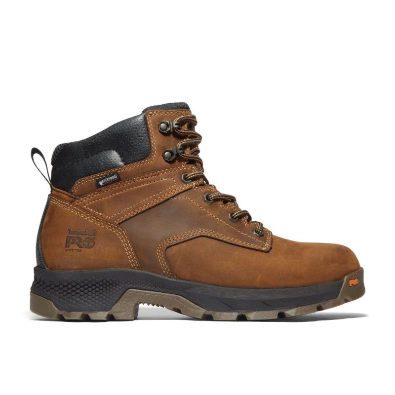 A single brown leather TIMBERLAND TITAN EV 6" WP SOFT TOE EARTH - MENS industrial boot with black accents, rugged sole, premium waterproof leather, and detailed stitching features anti-fatigue technology.