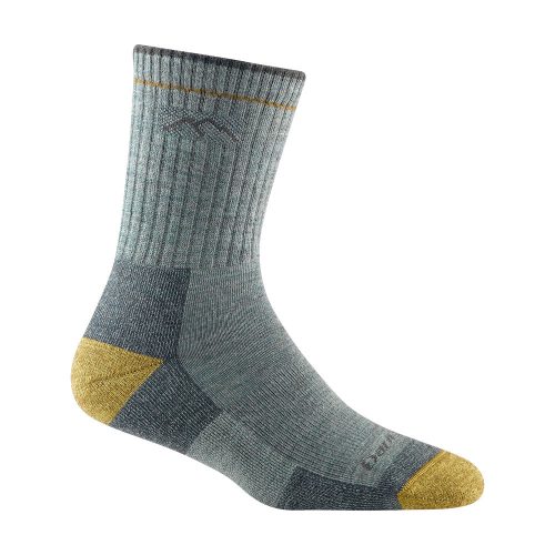 A single Darn Tough Hiker Micro Crew Socks Sage - Women's, with a reinforced yellow toe and heel, ribbed texture for added durability, and a subtle geometric pattern near the top ensures both comfort and a perfect fit.