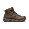 A brown and black high-top hiking boot with laces and a rugged sole, featuring the brand name "Keen" on the side, incorporates the KEEN.DRY system waterproof membrane to keep your feet dry during any adventure.