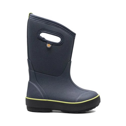 A single dark blue Bogs BOGS CLASSIC II TEXTURE SOLID NAVY - KIDS rain boot with a green trim and a handle on the side, designed for better traction and healthy foot growth, on a plain white background.