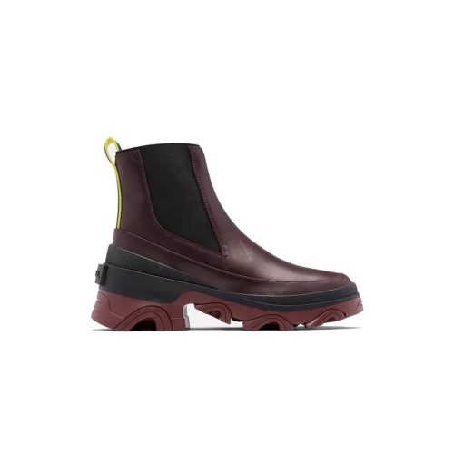 A dark red SOREL BREX BOOT CHELSEA NEW CINDER - WOMENS with black elastic side panels, a thick maroon sole, and a yellow pull tab at the back, designed for all-day comfort by Sorel.