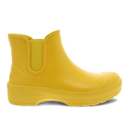 A Dansko DANSKO KARMEL YELLOW - WOMENS with elastic side panels, a cushioned footbed, and a reinforced toe.