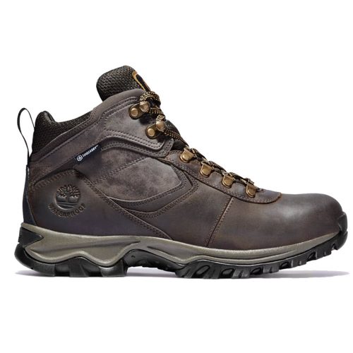 A TIMBERLAND MT. MADDSEN MID LEATHER WATERPROOF DARK BROWN - MENS with black accents, metallic eyelets, and a chunky sole featuring anti-fatigue comfort technology. The Timberland logo is embossed on the side.