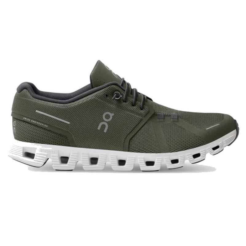 The On Running ON RUNNING CLOUD OLIVE/WHITE - MENS is a green athletic shoe with a white sole, featuring a mesh upper, grey laces, and the letters "o" and "n" on the side. The design includes distinct rectangular cutouts in the sole for cushioning with CloudTec® technology, making you feel like you're running on clouds.