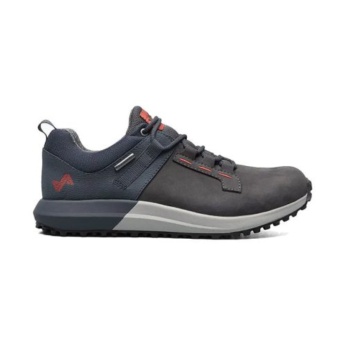 A single dark gray hiking shoe with a black sole, red accents, and a gray lace, viewed from the side. Featuring Vibram Megagrip technology, this waterproof sneakerboot promises superior traction and durability. Introducing the Forsake FORESAKE RANGE LOW GUNMETAL - MENS.