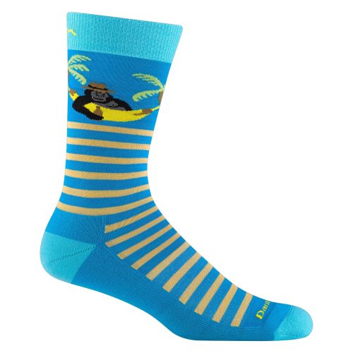 A blue and yellow striped sock featuring a graphic of a gorilla lounging in a hammock with palm trees, these Darn Tough DARN TOUGH WILD LIFE CREW SOCKS STORM - MENS are designed for all-day wearability.