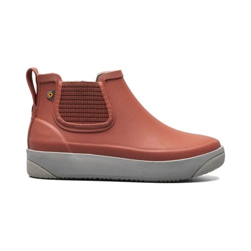 A single reddish-orange BOGS KICKER RAIN CHELSEA II EMBER - WOMENS ankle boot with a gray sole. The functional boot from Bogs features dual side elastic panels and a pull tab on the back for easy wear.