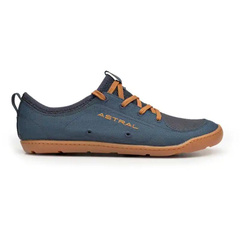 Side view of a dark blue and brown casual sneaker with a rubber sole, lace-up design, self-draining outsoles for amphibious adventures, and the product name "ASTRAL LOYAK NAVY/BROWN - MENS" printed on the side.