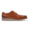 A brown leather lace-up shoe with glove-soft uppers and a cushioned sole, known as ROCKPORT TOTAL MOTION CRAFT APRON TOE COGNAC - MENS, viewed from the side against a white background.