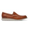 Brown leather Rockport Total Motion Craft Venetian Cognac loafers with stitching details, a low heel, and a lightweight white rubber sole, viewed from the side.