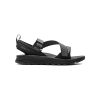 A black outdoor adventure sandal with adjustable straps, a thick textured sole, and a small loop at the back for easy pulling. Text "FORSAKE" printed on one of the straps. Made with recycled materials for sustainable footwear enthusiasts. Introducing the FORSAKE ROGUE BLACK - MENS from Forsake.