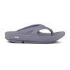 A side view of a single gray OOFOS OORIGINAL SLATE - MENS sandal with a thick OOfoam sole and a strap over the top featuring the "OO" logo, designed to reduce stress.