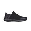 SKECHERS CESSNOCK RYLIND SLIP ON SR BLACK TEXTILE - MENS with a textured sole, mesh upper, and slip-resistant outsole.