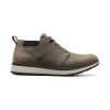 Side view of a single grayish-brown leather shoe with a white sole and metal eyelets, branded "Forsake" on the side. Featuring waterproof-grade leather and a Peak-to-Pavement® outsole, this Forsake FORSAKE DAVOS MID LODEN WATERPROOF - MENS is designed for versatile comfort.