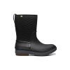 A Bogs BOGS CRANDALL II MID ZIP BLACK - WOMENS with a quilted upper design, sturdy sole, zippered openings, and a pull-on loop at the back, ensuring warmth and ease of wear.