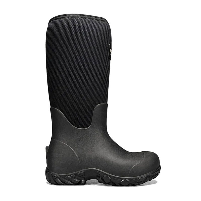 The Bogs BOGS WORKMAN 17" SOFT TOE BLACK - MENS is a black rubber and neoprene waterproof boot with seamless construction and a textured sole, designed for outdoor and wet conditions.