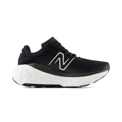 The New Balance Fresh Foam X 840v1 Black/Magnet for women is an athletic shoe featuring a black synthetic upper, white soles, and a white logo on the side. Designed with a thick, textured sole, this shoe is perfect for everyday wear.