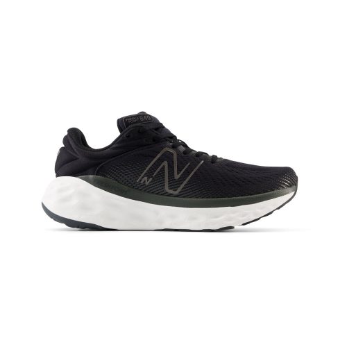 Side view of a black athletic shoe with a white sole and the "NB" logo on the side, designed for running and ideal for low-impact activities. The New Balance NEW BALANCE FRESH FOAM X 840V1 BLACKTOP/BLACK - MENS features New Balance Fresh Foam X technology, ensuring a comfortable fit.