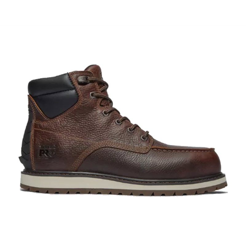 The Timberland TIMBERLAND IRVINE WEDGE 6 INCH ALLOY TOE BROWN - MENS is a brown, full-grain leather ankle-high men's work boot with a textured sole and padded collar.