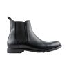 Side view of a black leather Chelsea boot with an elastic side panel and pull-tab on the back, featuring Frye's FRYE TYLER CHELSEA PULL ON BOOT BLACK - MENS flexible Blake construction.