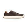 A dark brown low-top sneaker crafted from high-character leathers, featuring a white rubber sole and light brown heel tab, promising sophisticated comfort with every step. The Olukai OLUKAI LAEAHILIILI WATERPROOF LEATHER DARK JAVA - MENS is perfect for any occasion.