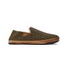 Olukai OLUKAI HANOHANO CANVAS SHEARLING SLIPPER HUSK - MENS with a brown sole and quilted pattern, featuring a small leather patch on the side. Crafted from weather-resistant waxed canvas, this design offers durability with an island-inspired style.