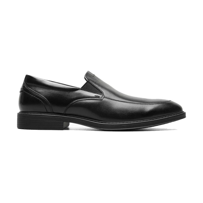 A black leather NUNN BUSH CENTRO FLEX MOC TOE VENETIAN BLACK SMOOTH - MENS slip-on dress shoe with a low heel, smooth finish, and Centro Flex for added flexibility by Nunn Bush.