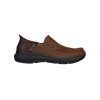 Dark brown slip-on shoe with black rubber sole and dark brown quilted heel detail, featuring "SKECHERS PARSON MOC TOE LEATHER SLIP ON DARK BROWN - MENS" branding on the side. This design incorporates Air-Cooled Memory Foam for enhanced comfort.