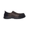 A Skechers SKECHERS COMPOSITE TOE LOEMAN SLIP ON CRAZY HORSE DARK BROWN - MENS, a brown and black slip-on work shoe with a thick sole, designed for durability and comfort, featuring Air-Cooled Memory Foam for enhanced cushioning.