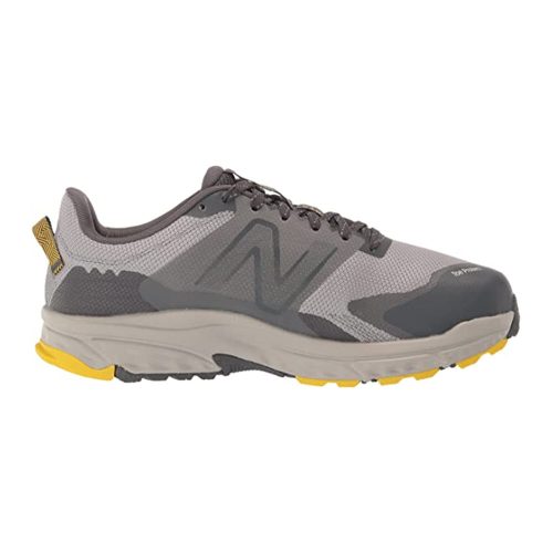 A gray and yellow New Balance NEW BALANCE 510V6 RAIN CLOUD - MENS with a mesh upper, rubber sole, and lace-up closure, featuring the side logo and AT Tread technology.