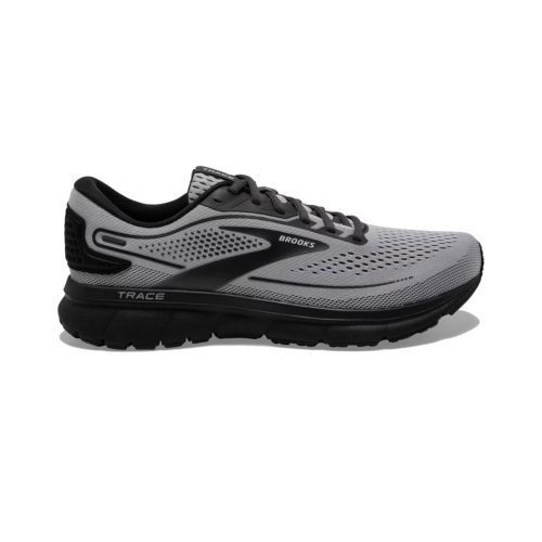 A gray and black running shoe with the brand name "Brooks" and model name "BROOKS TRACE 2 ALLOY/BLACK/EBONY - MENS" displayed. The shoe features a breathable mesh upper and dynamic cushioning for a comfortable fit.