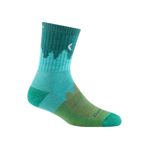 A Darn Tough DARN TOUGH TREELINE MICRO CREW SOCKS AQUA - WOMENS made from Merino Wool with a forest and crescent moon design, featuring varying shades of green and blue. The material absorbs impact and minimizes moisture for ultimate comfort.