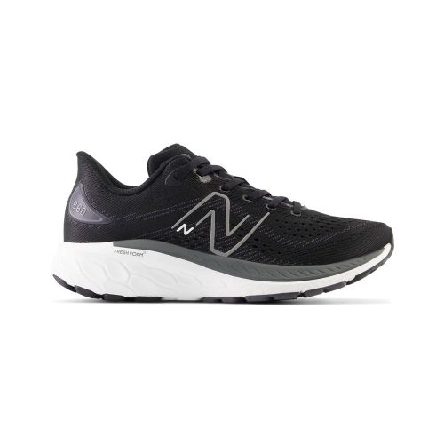 Black athletic shoe with a white sole, featuring the New Balance logo and a supportive medial post. The model is identified as NEW BALANCE 860 V13 BLACK/WHITE - KIDS, equipped with the comfortable Fresh Foam X midsole.