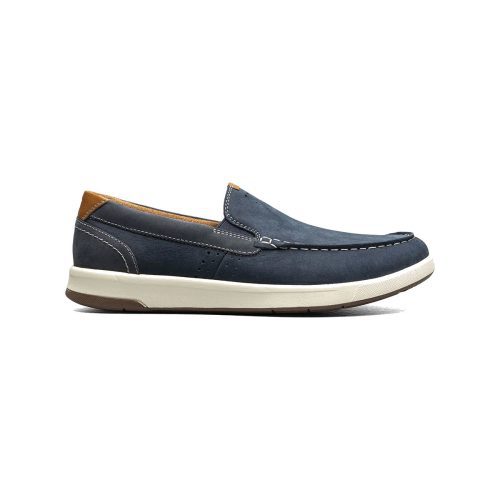 Single blue casual **FLORSHEIM CROSSOVER MOC TOE SLIP ON NAVY NUBUCK - MENS** with comfortable brown accents, lightweight white sole, and stitched detailing. Side profile view on a white background.